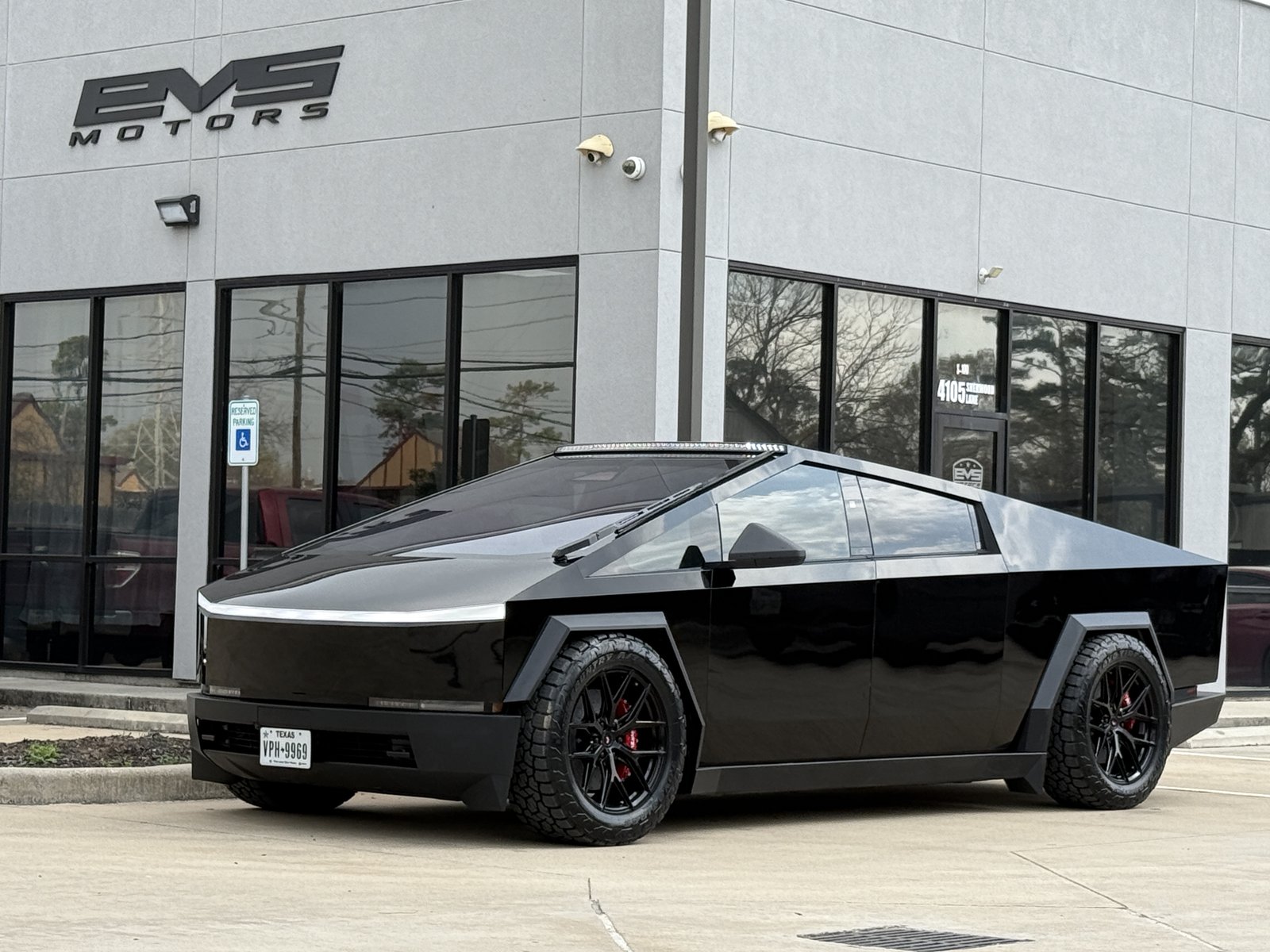 Gloss black Cybertruck at EVS 4105 with plate VPH-9969