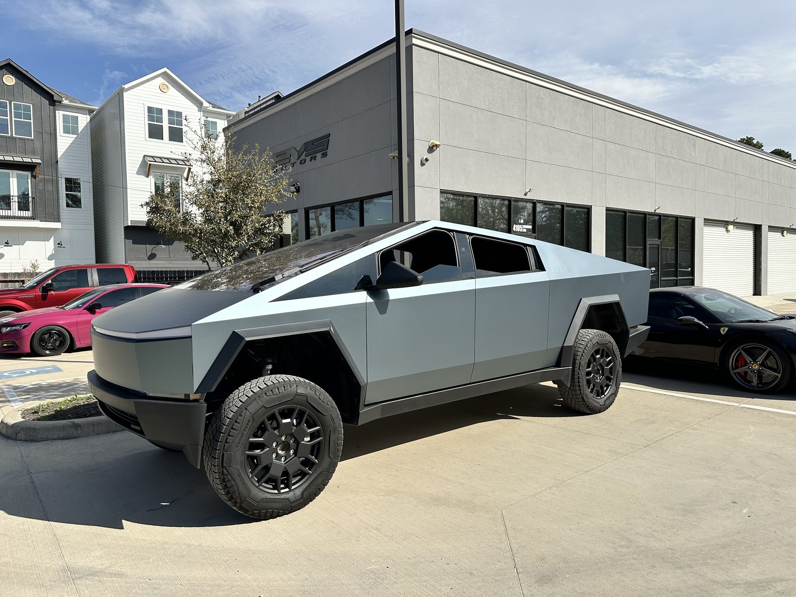 Lifted blue-grey Cybertruck at EVS Motors