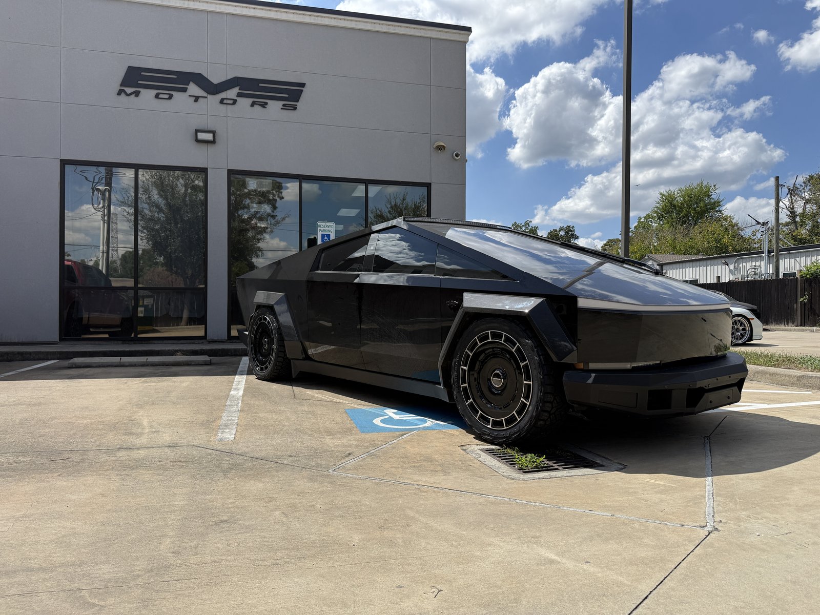 Satin black Cybertruck with turbine wheels and flares at EVS Motors