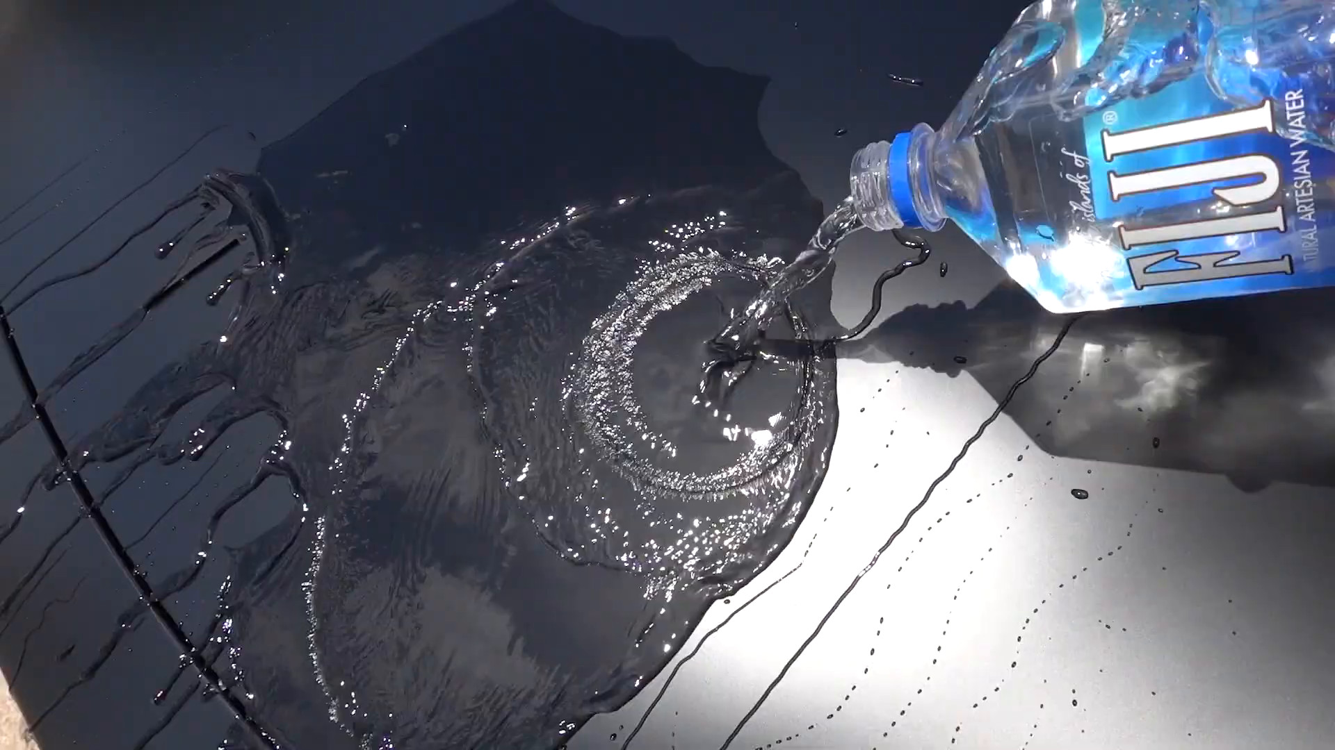 Water beading on a ceramic-coated paint surface