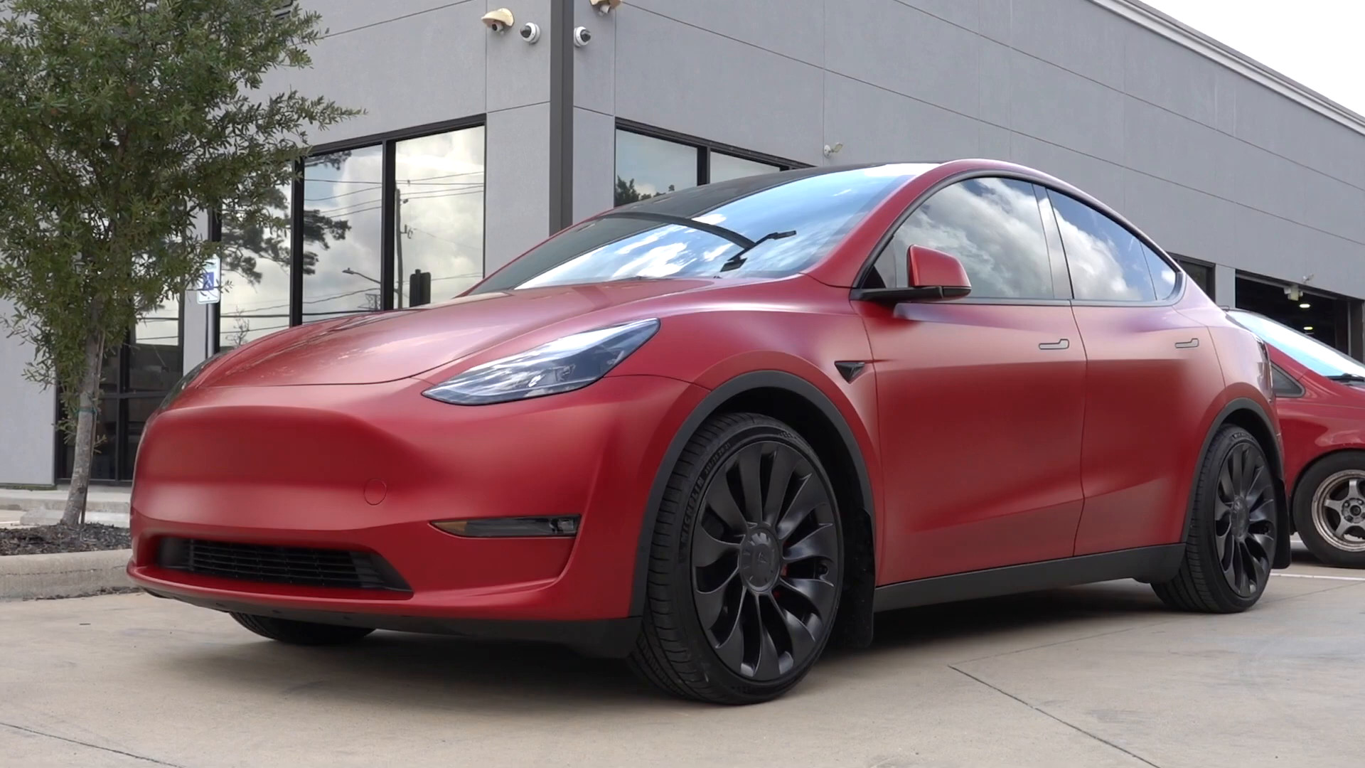 Red Tesla Model Y with satin paint protection film
