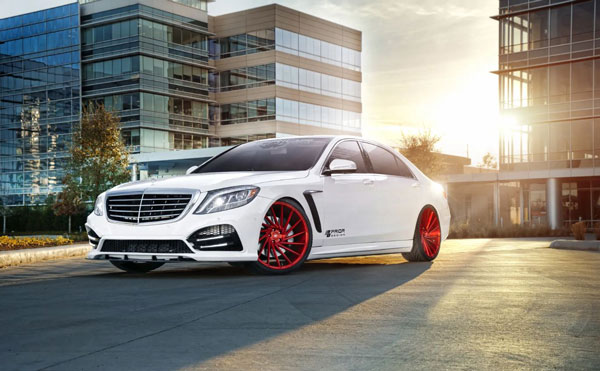 Custom White Car with Red Wheels in Lot