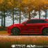Prior Design aero kit for a red Porsche, side view