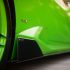 Close-up of green Lamborghini Huracan, showing the Vorsteiner logo.